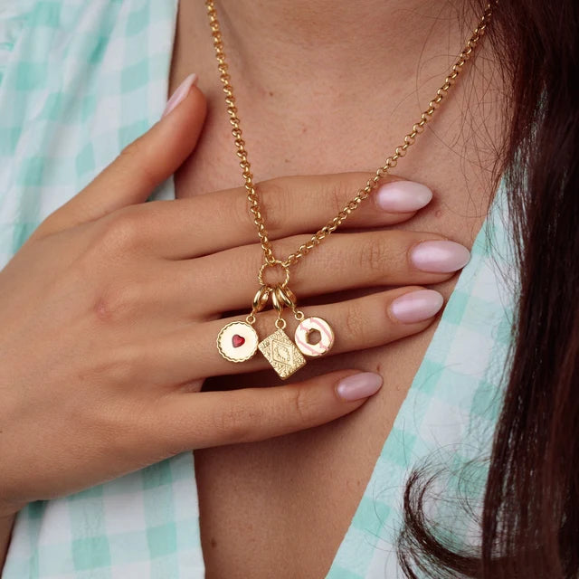 Lily Charmed gold Party Ring biscuit charm with pink enamel in 18ct gold-plated sterling silver on a necklace