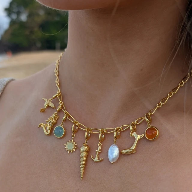 Gold My Story charm collector necklace by Lily Charmed in 18ct gold plated sterling silver with multiple charms attached 