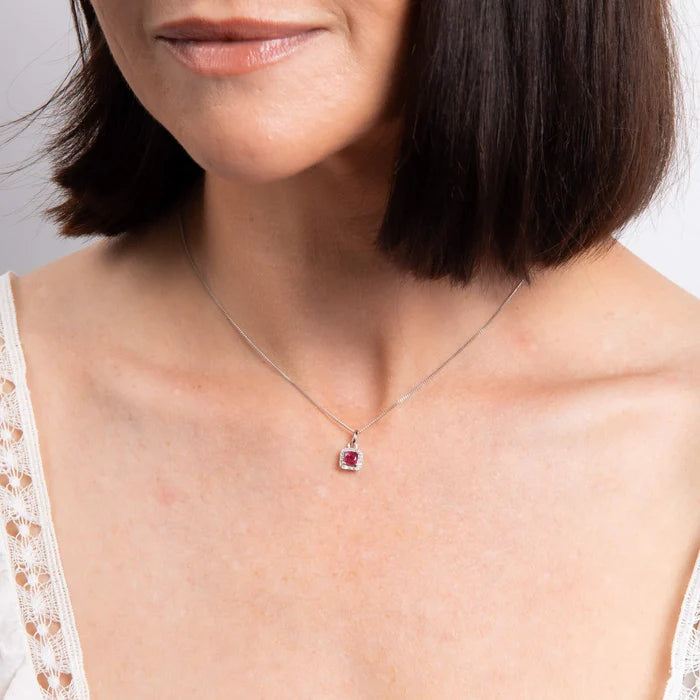 Ruby and diamond halo necklace by Marcus Tempus