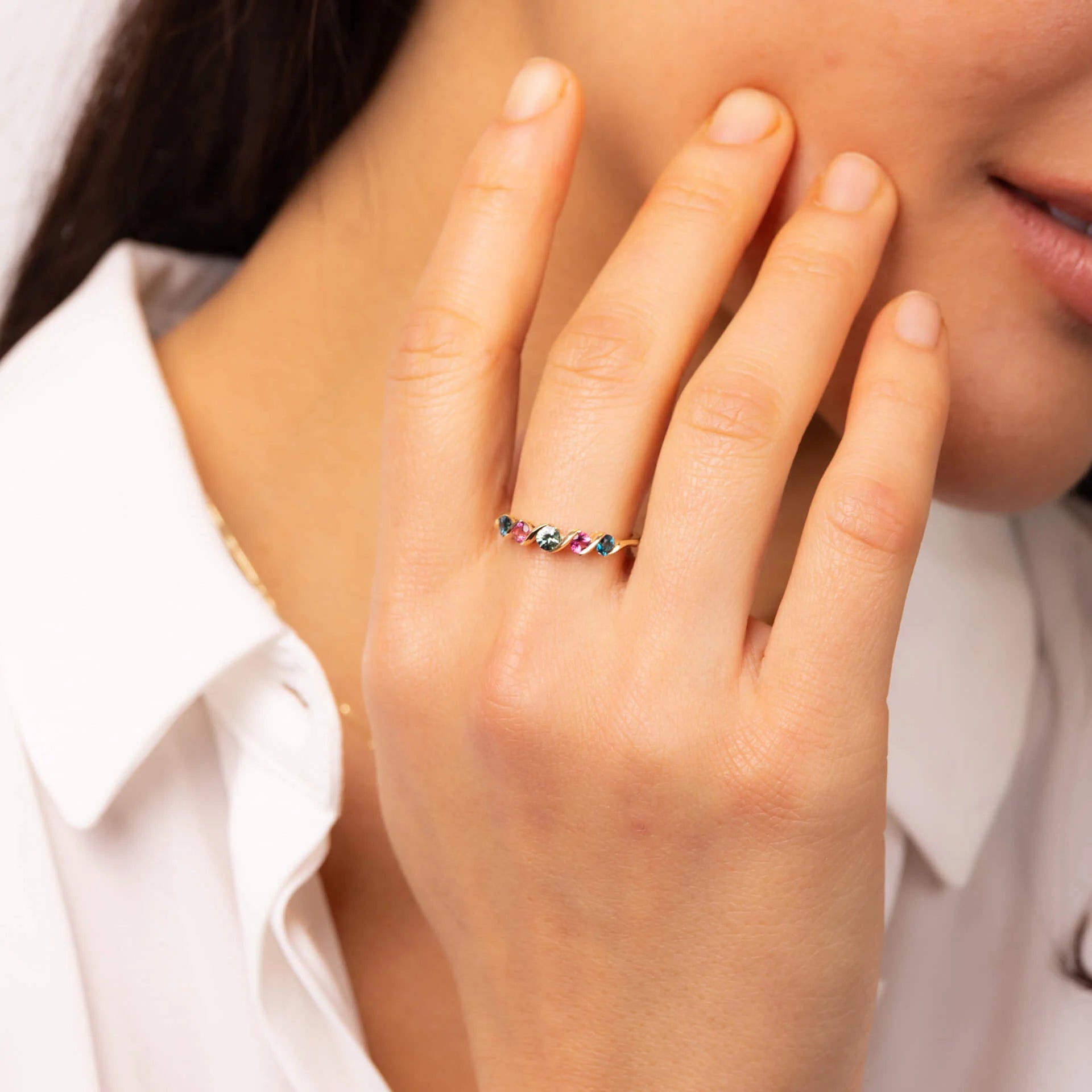 9ct yellow gold Amalfi gemstone ring with London blue topaz, pink tourmaline and green sapphire in a flowing contemporary wave design.